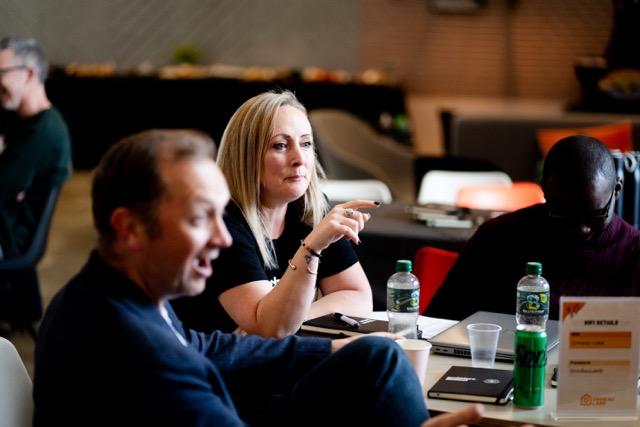 Founders at a table, active conversation