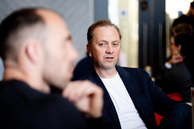 Two founders in close conversation